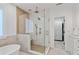 Elegant bathroom boasting a walk-in shower with glass surround, a soaking tub, and a doorway to a walk-in closet at 1010 Lake Shore Overlook, Alpharetta, GA 30005