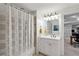 Bathroom features a shower, a white vanity with a granite counter and gray patterned shower curtain at 1010 Lake Shore Overlook, Alpharetta, GA 30005
