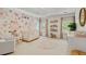 Lovely bedroom featuring a floral wallpaper, a crib, and matching decor at 1010 Lake Shore Overlook, Alpharetta, GA 30005