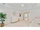 Bright bedroom featuring a vaulted ceiling, soft carpet, and a crib and dresser at 1010 Lake Shore Overlook, Alpharetta, GA 30005