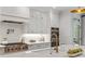 Well-appointed kitchen boasts stainless appliances, bright white countertops, and pot filler for the discerning chef at 1010 Lake Shore Overlook, Alpharetta, GA 30005
