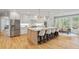 Gourmet kitchen featuring an island with seating, stainless steel appliances, and bright countertops at 1010 Lake Shore Overlook, Alpharetta, GA 30005