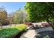 Beautifully landscaped front yard with lush greenery and a stone walkway leading to the front entrance at 1010 Lake Shore Overlook, Alpharetta, GA 30005