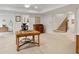 Open living space with neutral carpet, and desk with stairs nearby at 1010 Lake Shore Overlook, Alpharetta, GA 30005