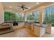 The covered outdoor kitchen features a built-in grill and sink, perfect for al fresco entertaining at 1010 Lake Shore Overlook, Alpharetta, GA 30005