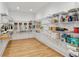 Walk-in pantry with ample shelving and hardwood floors providing abundant storage at 1010 Lake Shore Overlook, Alpharetta, GA 30005
