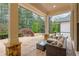 Relaxing outdoor patio area with comfortable seating and scenic backyard views at 1010 Lake Shore Overlook, Alpharetta, GA 30005