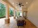Inviting covered patio features stone accents, ceiling fan, and spacious dining area at 1010 Lake Shore Overlook, Alpharetta, GA 30005