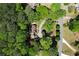 This aerial view shows the home's expansive lot, circular drive, and mature trees at 1745 Shady Hill Ne Rd, Marietta, GA 30068