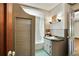 Bathroom with shower over tub combination with floral wallpaper at 1745 Shady Hill Ne Rd, Marietta, GA 30068