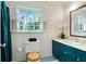 This beautiful bathroom has a floral wallpaper, a large window, and a shower with a curtain at 1745 Shady Hill Ne Rd, Marietta, GA 30068