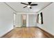 Bedroom features hardwood floors, neutral walls, and natural light from window at 1745 Shady Hill Ne Rd, Marietta, GA 30068