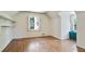 This bright bedroom offers hardwood floors, a window with shutter, and open shelving at 1745 Shady Hill Ne Rd, Marietta, GA 30068