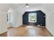 Bedroom with hardwood floors, neutral and blue accent wall, and windows for natural light at 1745 Shady Hill Ne Rd, Marietta, GA 30068