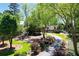 The exterior of the house features a circular driveway, mature trees, and beautiful landscaping at 1745 Shady Hill Ne Rd, Marietta, GA 30068
