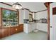 Eat-in kitchen area featuring tile flooring and a large picture window overlooking backyard at 1745 Shady Hill Ne Rd, Marietta, GA 30068