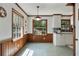 Eat-in kitchen area featuring tile flooring and large picture window overlooking backyard at 1745 Shady Hill Ne Rd, Marietta, GA 30068