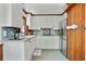 Cozy kitchen with stainless steel refrigerator and white cabinets and counters at 1745 Shady Hill Ne Rd, Marietta, GA 30068