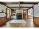 Spacious living room boasting hardwood floors, fireplace, and exposed beam ceiling at 1745 Shady Hill Ne Rd, Marietta, GA 30068