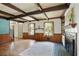 Well-lit living room with wooden trim and an exposed beam ceiling at 1745 Shady Hill Ne Rd, Marietta, GA 30068