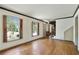 Spacious living room with hardwood floors and natural light through large windows at 1745 Shady Hill Ne Rd, Marietta, GA 30068