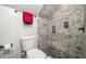 The bathroom boasts a river rock shower floor and sleek glass shower door at 2964 Anderson Se Cir, Smyrna, GA 30080