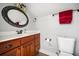 The bathroom features an oval mirror and a wood vanity at 2964 Anderson Se Cir, Smyrna, GA 30080