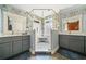 This bathroom offers dual sink vanities and walk-in shower with mosaic tile floor at 2964 Anderson Se Cir, Smyrna, GA 30080