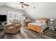 Bedroom featuring vaulted ceilings, hardwood floors, a ceiling fan, and an expansive window at 2964 Anderson Se Cir, Smyrna, GA 30080