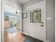 View of the light-filled foyer leading to an office space with hardwood floors and fresh paint at 2964 Anderson Se Cir, Smyrna, GA 30080
