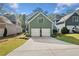 Detached two-car garage with an attached driveway and well-maintained lawn at 2964 Anderson Se Cir, Smyrna, GA 30080