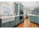 Bright kitchen features a farmhouse sink, stainless steel appliances, and hardwood floors at 2964 Anderson Se Cir, Smyrna, GA 30080