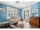This living room offers hardwood floors, natural light, and access to a porch at 2964 Anderson Se Cir, Smyrna, GA 30080