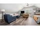 Bright living room featuring vaulted ceiling, ceiling fan, and comfortable seating arrangement at 2964 Anderson Se Cir, Smyrna, GA 30080