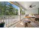 Inviting porch with a daybed swing and comfortable seating to enjoy the weather at 2964 Anderson Se Cir, Smyrna, GA 30080