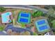 An aerial view of the community pool, tennis courts, and parking area at 3045 Hartridge Dr, Johns Creek, GA 30022