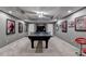 Finished basement features ping pong table and decor on the walls and ceiling at 3045 Hartridge Dr, Johns Creek, GA 30022