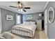 Calming bedroom features soft gray walls, a cozy bed, and elegant decor at 3045 Hartridge Dr, Johns Creek, GA 30022