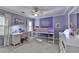 Bright bedroom featuring a bunk bed, desk, white trim, and neutral carpet at 3045 Hartridge Dr, Johns Creek, GA 30022