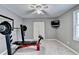 Bedroom with grey walls, ceiling fan, television and workout equipment at 3045 Hartridge Dr, Johns Creek, GA 30022