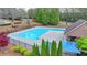 Community pool with fenced-in area, sun deck, and adjacent building at 3045 Hartridge Dr, Johns Creek, GA 30022