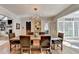 Elegant dining room features hardwood floors and modern lighting fixture at 3045 Hartridge Dr, Johns Creek, GA 30022