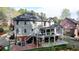 A spacious home with a deck, a patio and a yard at 3045 Hartridge Dr, Johns Creek, GA 30022