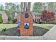 Charming front yard with lush landscaping and a brick mailbox in front of a home at 3045 Hartridge Dr, Johns Creek, GA 30022