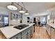 Open-concept kitchen featuring a center island, modern appliances, and seamless flow to dining area at 3045 Hartridge Dr, Johns Creek, GA 30022