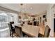 Open concept kitchen with hardwood floors, an island, an eat in dining area, and modern lighting at 3045 Hartridge Dr, Johns Creek, GA 30022