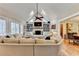 Cozy living room featuring vaulted ceilings, built-in shelving, fireplace and comfortable seating at 3045 Hartridge Dr, Johns Creek, GA 30022