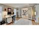 Well-lit office space with hardwood floors, neutral walls, and view to a spacious foyer at 3045 Hartridge Dr, Johns Creek, GA 30022