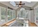 Sunroom features natural light, skylights, and backyard views at 3045 Hartridge Dr, Johns Creek, GA 30022