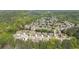 Panoramic aerial view of a residential area surrounded by dense green forests at 622 Rocky Creek Pt, Woodstock, GA 30188